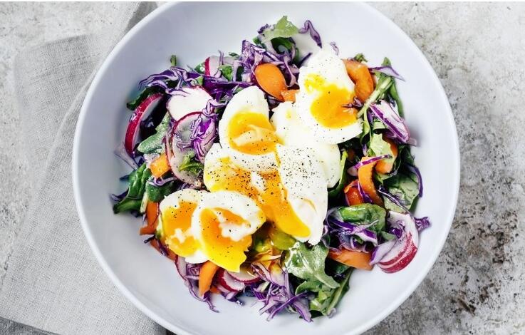 Fresh salad with soft boiled eggs